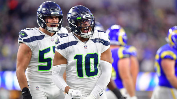 Seattle Seahawks linebacker Uchenna Nwosu (10) and linebacker Cody Barton (57) react against the Los Angeles Rams during the second half at SoFi Stadium.